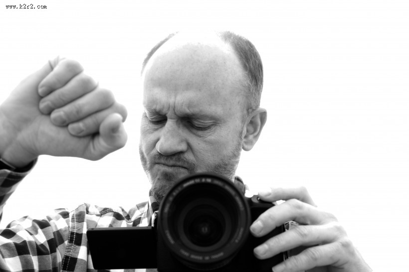 正在拍照的男摄影师图片大全