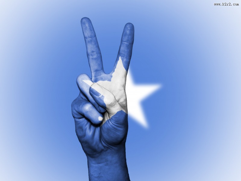 国旗背景的胜利手势图片