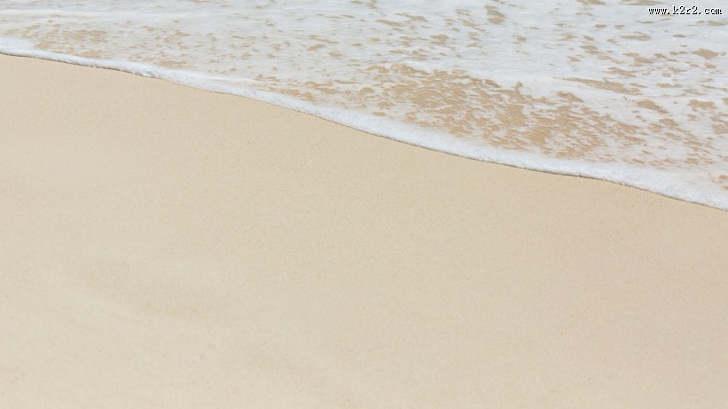 白色沙滩上的海浪图片